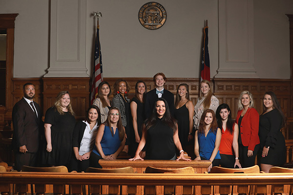 Glenda Mitchell And Her Team In A Courtroom